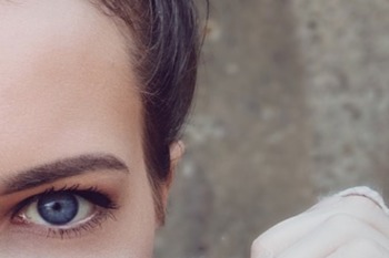 A woman's bright blue eye up close